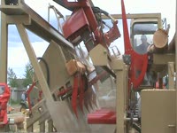 Twin-Cut portable sawmill from Lumber outfeed view