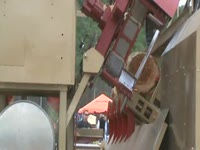 Twin-Cut portable sawmill waste conveyor end view