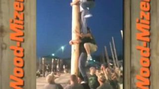 Wood-Mizer Guys climb pole at Booneville show