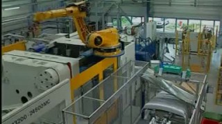 Handling of bumpers at a plastics processing machine with a KUKA robot - Роботы Kuka